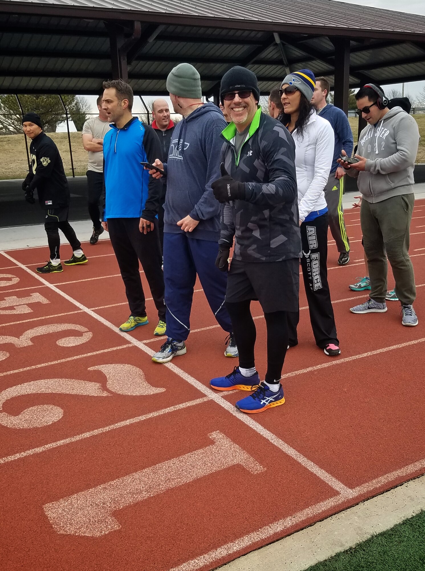 Christopher Parr, 932nd Airlift Wing Public Affairs specialist, is thumbs up as he starts the first 400m sprint during the Scott Health Promotion running clinic, Feb. 1, 2017, Scott Air Force Base, Illinois. You can follow along as Parr documents his journey to becoming a better runner in the commentaries section of the 932nd AW website.  (U.S. Air Force photo by Christopher Parr)