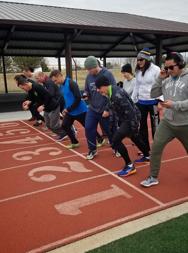 Group 1 members of the  Scott Health Promotion running clinic run the first of six 400m sprints Feb. 1, 2017, Scott Air Force Base, Illinois. You can follow along as Christopher Parr, a public affairs specialist with the 932nd Airlift Wing, documents his journey to becoming a better runner in the commentaries section of the 932nd AW website.  (U.S. Air Force photo by Christopher Parr)