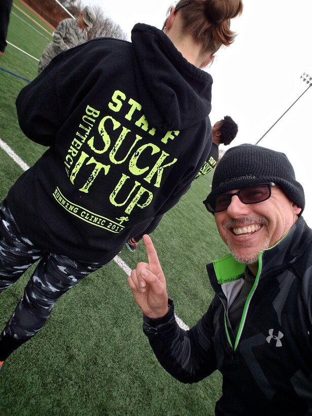 Christopher Parr, 932nd Airlift Wing Public Affairs specialist, enjoys the humor of one of the staff's sweatshirts during the Scott Health Promotion running clinic, Feb. 1, 2017, Scott Air Force Base, Illinois. You can follow along as Parr documents his journey to becoming a better runner in the commentaries section of the 932nd AW website.  (U.S. Air Force photo by Christopher Parr)