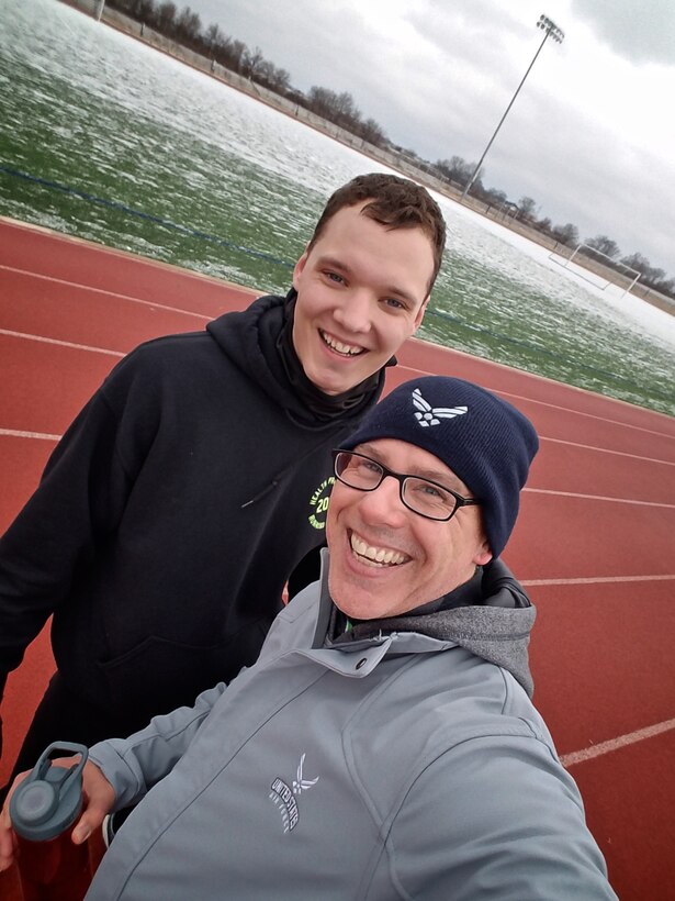 Christopher Parr, 932nd Airlift Wing Public Affairs specialist, poses with Group 1 leader and "fast runner" Senior Airman Jason Stonehocker, information assurance technician with the 375th Communication Support Squadron Feb. 8, 2017 at Scott Air Force Base, Illinois.  You can follow along as Parr documents his journey to becoming a better runner in the commentaries section of the 932nd AW website.  (U.S. Air Force photo by Christopher Parr)