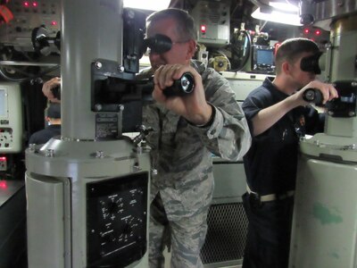 U.S. Air Force Gen. John E. Hyten (left), commander of U.S. Strategic Command (USSTRATCOM), looks through a periscope aboard the Ohio-class ballistic missile submarine USS Tennessee (SSBN 734) during a force familiarization trip, Feb. 2, 2017. The visit, Hyten’s first as commander of USSTRATCOM, allowed him to observe his combat ready forces at Naval Station Norfolk, Va.; Naval Submarine Base Kings Bay, Ga.; Barksdale Air Force Base, La.; and at sea. One of nine DoD unified combatant commands, USSTRATCOM has global strategic missions assigned through the Unified Command Plan that include strategic deterrence; space operations; cyberspace operations; joint electronic warfare; global strike; missile defense; intelligence, surveillance and reconnaissance; and analysis and targeting.