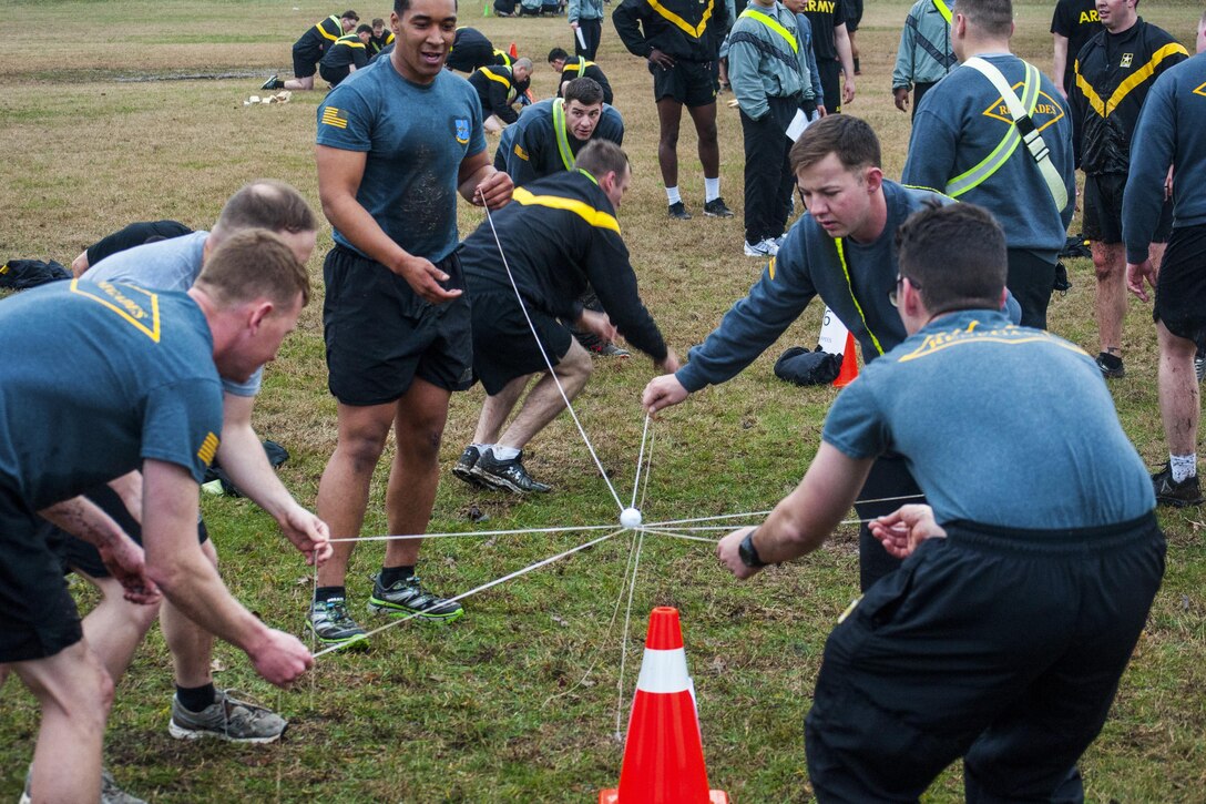 Soldiers attempt to balance an object during a team-building exercise as part of a challenge with physical and mental events at Fort Campbell, Ky., Feb. 8, 2017. The soldiers are assigned to the 101st Airborne Division's 2nd Battalion, 502nd Infantry Regiment, 2nd Brigade Combat Team. Part of the battalion recently returned from supporting Operation Inherent Resolve in Iraq. Army photo by 1st Lt. Daniel Johnson

