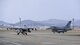 Two F-16 Fighting Falcons assigned to the 119th Fighter Squadron from the New Jersey Air National Guard taxi off of the runway at Osan Air Base, Republic of Korea, Feb. 9, 2017. Members of the 177th Fighter Wing deployed to Osan as part of a Theater Security Package to help bolster the strength of allied air forces on the Korea peninsula. (U.S. Air Force photo by Staff Sgt. Victor J. Caputo)