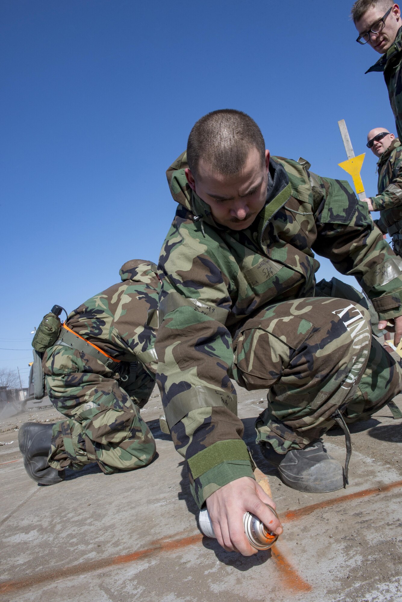 Airmen with the 374th Civil Engineering Squadron mark concrete for cutting during a Rapid Airfield Damage Repair exercise Feb. 8, 2017, at Yokota Air Base, Japan. RADR is a modern airfield repair process to efficiently fix a runway in the event of an incident. (U.S. Air Force photo by Airman 1st Class Donald Hudson)