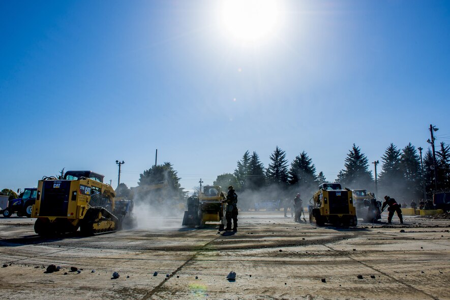 Airmen with the 374th Civil Engineering Squadron perform a Rapid Airfield Damage Repair exercise Feb. 8, 2017, at Yokota Air Base, Japan. The 374 CES can repair about 18 damaged runway areas in approximately six hours using the RADR method. (U.S. Air Force photo by Airman 1st Class Donald Hudson)