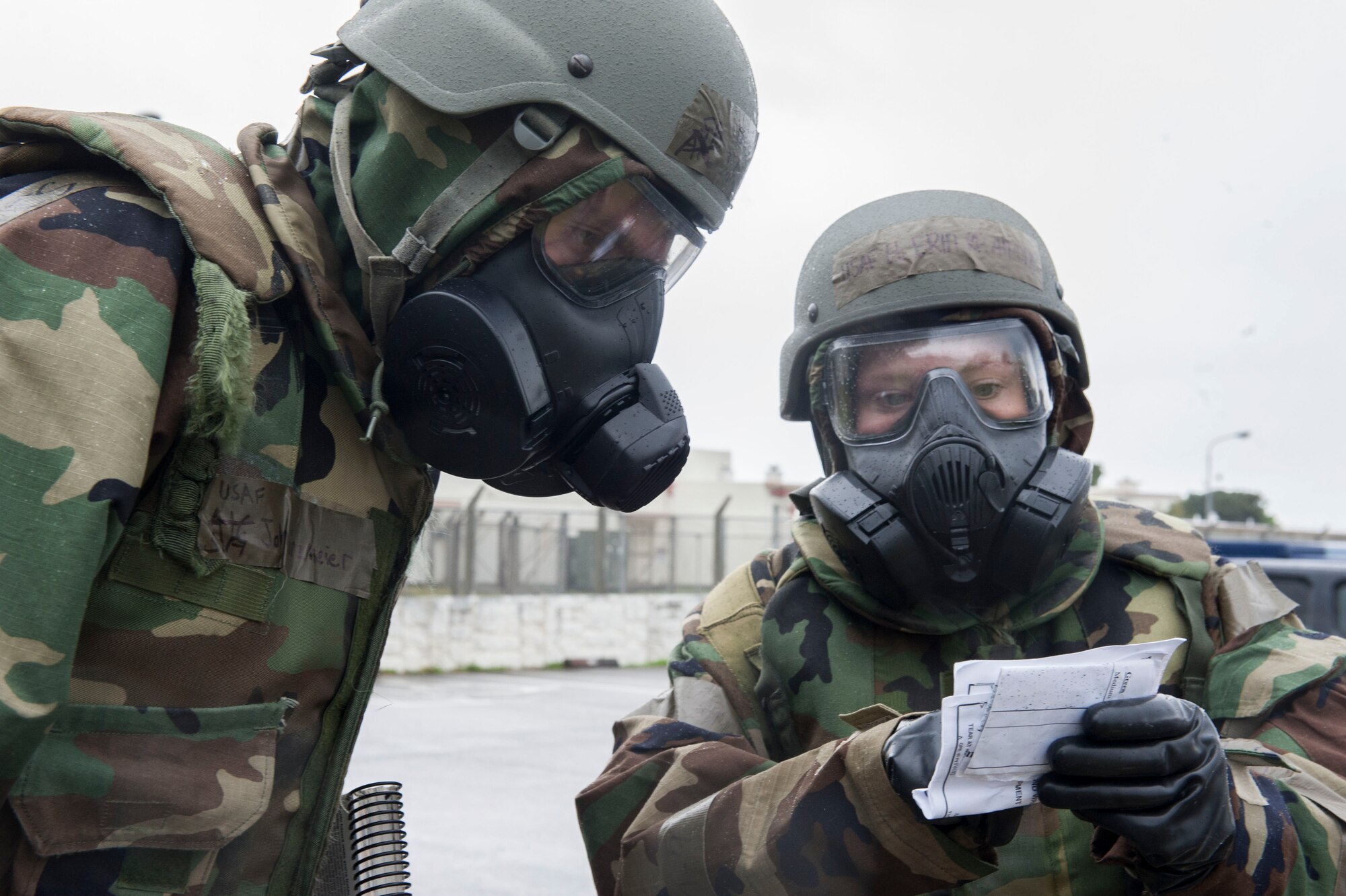 U.S. Air Force Airmen from Kadena Air Base, Japan, examine a post-attack reconnaissance stand during Exercise Green Dragon Feb. 9, 2017. Simulated conventional and chemical attack situations occurred during the exercise, testing Kadena’s readiness for such situations. (U.S. Air Force photo by Senior Airman Lynette M. Rolen/Released)