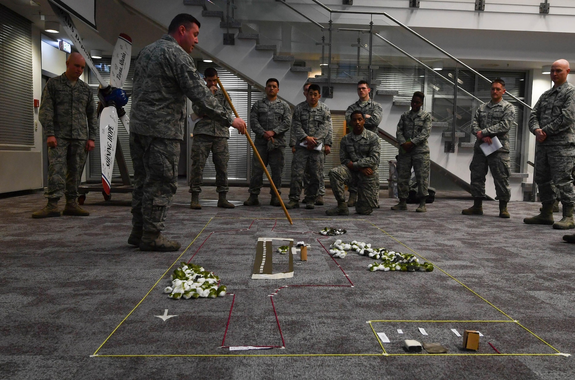 Tech. Sgt. George Broom, 435th Contingency Response Squadron contingency airfield manager, briefs Airmen assigned to the 435th Contingency Response Group about the base they are deploying to during Exercise Austere Forge at Ramstein Air Base, Germany, Jan. 30, 2017. The Airmen participated in the exercise to practice their capability to deploy within 72 hours. (U.S. Air Force photo by Senior Airman Tryphena Mayhugh)
