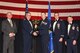 Tech. Sgt. James C. Klusener, 22nd Operations Support Squadron,center, accepts the 2016, Noncommissioned Officer of the Year award, Feb. 3, 2017, at McConnell Air Force Base, Kan. The annual awards ceremony recognized military and civilian members who excel in their areas of responsibilities, leadership qualities, community involvement, self-improvement and innovation from January to December 2016. (U.S. Air Force photo/Senior Airman Christopher Thornbury)