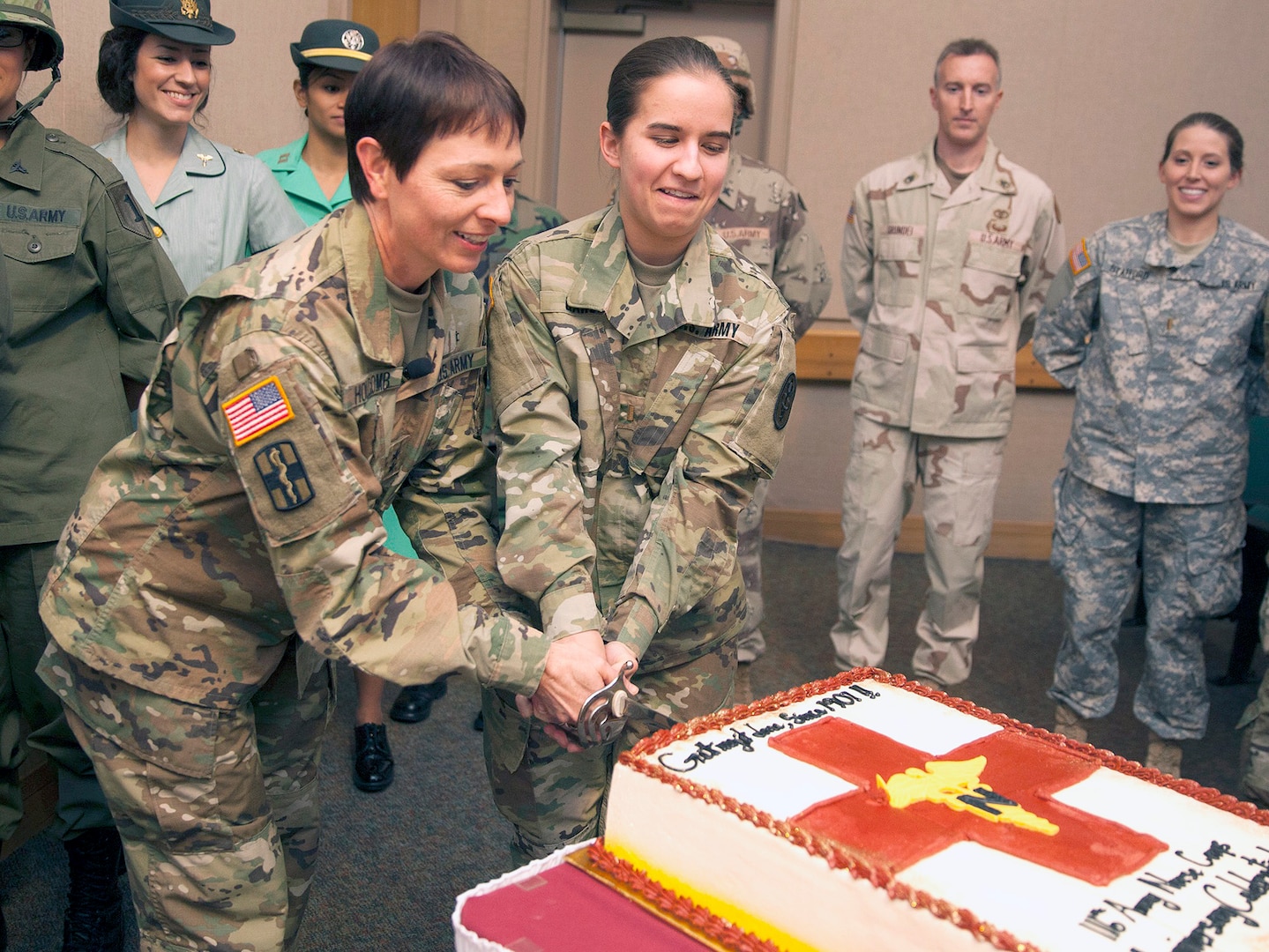 Maj. Gen. Barbara Holcomb, chief of the U.S. Army Nurse Corps, and the youngest Army nurse in attendance, Army 2nd Lt. Jennifer Garcia, cut the cake to celebrate the 116th birthday of the Army Nurse Corps Feb. 2 during a ceremony in the Brooke Army Medical Center auditorium at Joint Base San Antonio-Fort Sam Houston.