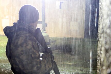 U.S. Army Reserve soldier Sfc. Juan Padilla stands guard while on mission during Best Warrior Competition Fort Hunter Liggett Calif. on February 6, 2017. The mission included talking to the town mayor and rescuing a simulated injured pilot. 