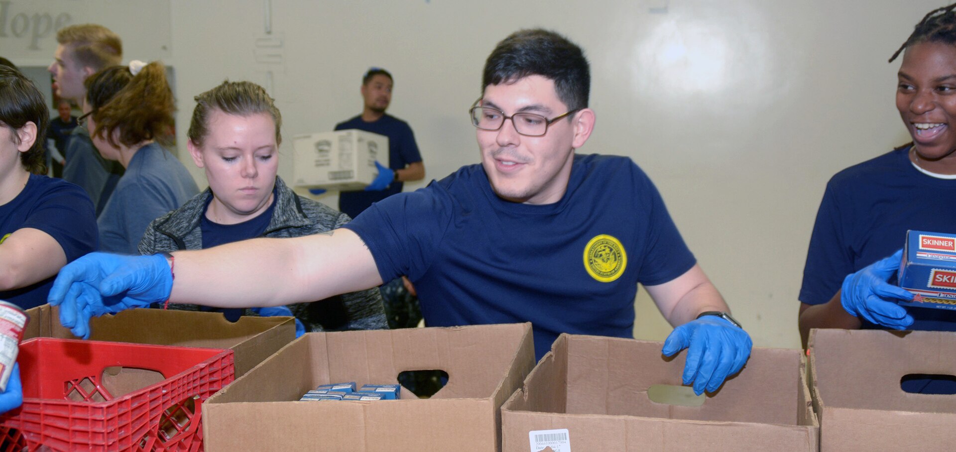 Cesar Lozano, a future Sailor in the Navy Delayed Entry Program, or DEP, volunteers at the San Antonio Food Bank.  Lozano, a 2014 graduate of Veterans Memorial High School in Brownsville, participated in the bi-weekly DEP meeting hosted by Navy Recruiting Station Northeast San Antonio.  The purpose of the volunteerism was to instill the “Whole Sailor Concept”.  Lozano will attend recruit training in Great Lakes, Mich. in April with follow-on training as an aviation structural mechanic.