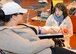 Alicia Murgolo, left, 48th Civil Engineer Squadron spouse, discusses the donation process with Pamela Hudson, phlebotomist technician from the Armed Services Blood Program-Europe, Landstuhl Regional Medical Center, Germany, as she gives blood Feb. 7, 2017, on RAF Mildenhall, England. More than 70 units of blood were donated by Team Mildenhall members, which will be used to support missions in European Command, Central Command and Africa Command, as well as in military treatment facilities.    (U.S. Air Force photo by Karen Abeyasekere)