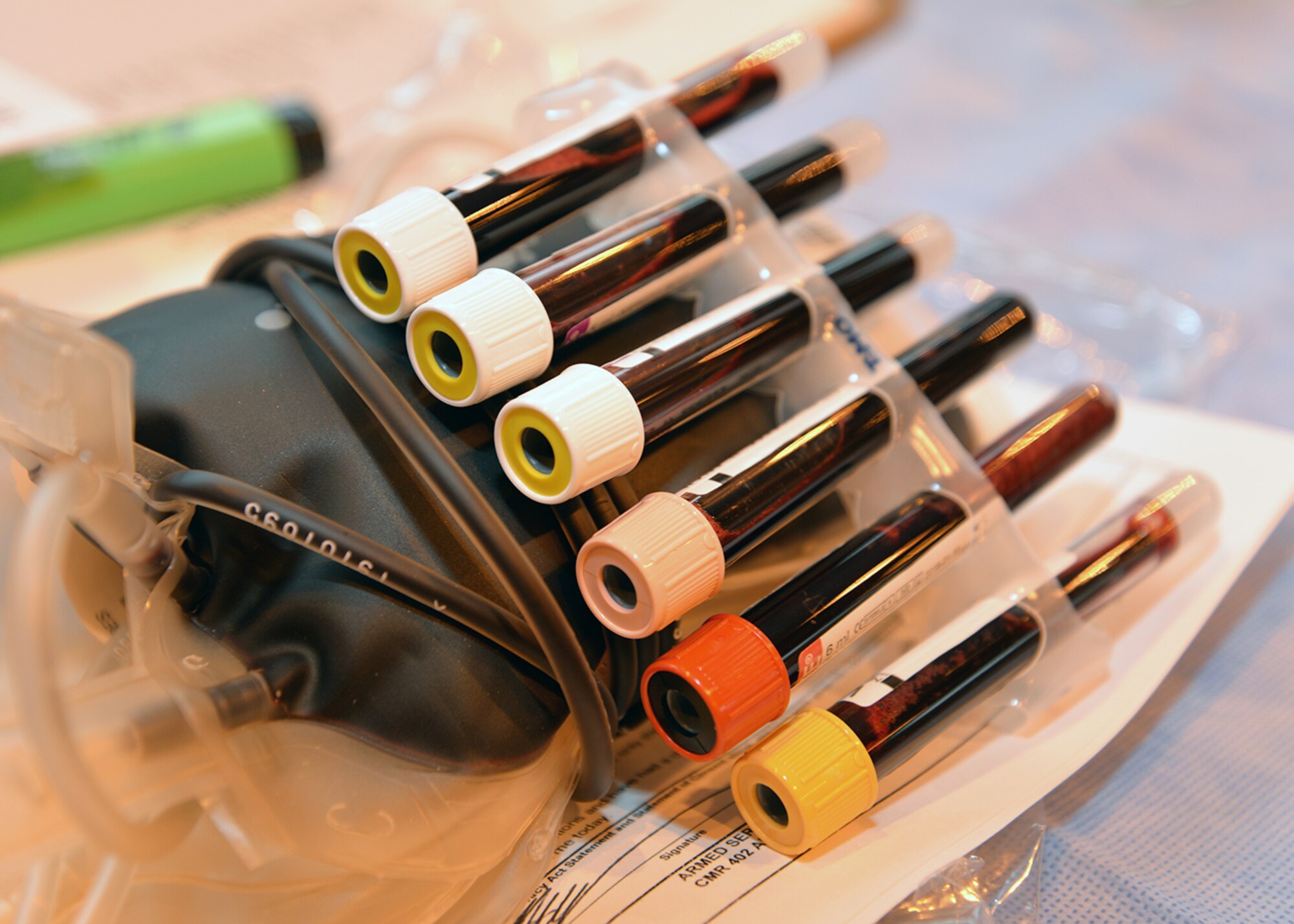 Test tubes placed with a unit of blood from a donor lay waiting to be checked at the blood-processing station before being packed for shipment Feb. 7, 2017, on RAF Mildenhall, England. A medical team from Armed Services Blood Program-Europe, Landstuhl Regional Medical Center, Germany, visited RAF Mildenhall and RAF Lakenheath to hold the blood drive, and collected more than 70 units of blood from Team Mildenhall members. (U.S. Air Force photo by Karen Abeyasekere)
