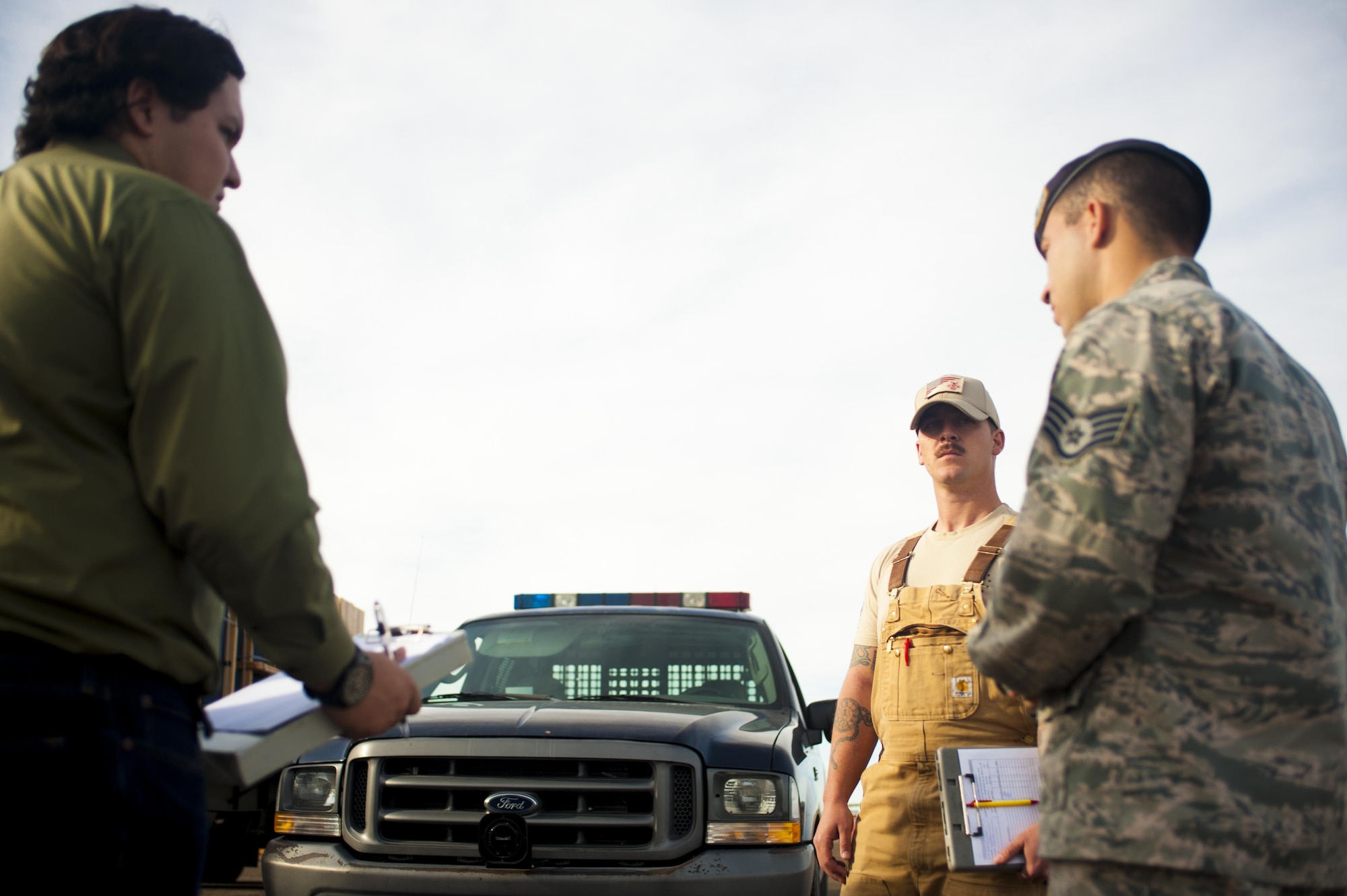 U.S. Staff Sgt. Tyler Wiseman and Air Force Staff Sgt. Dakoda Riddle, 17th Security Forces Squadron K9 handlers, prepare students from Ballinger High school for a dog search demonstration at Goodfellow Air Force Base, Texas, Feb. 8, 2017. The students visited Goodfellow Air Force Base to help their decision to join the military. (U.S. Air Force photo by Senior Airman Scott Jackson/Released)