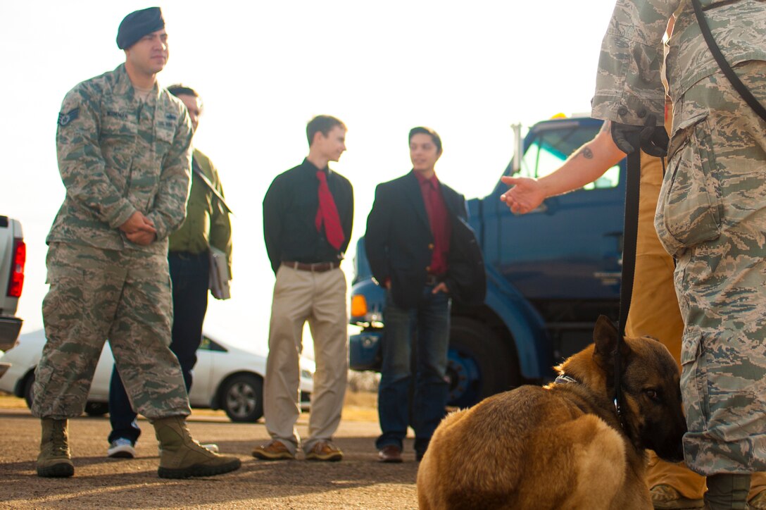 U.S. Air Force Staff Sgt. Tyler Wiseman, 17th Security Forces Squadron K9 handler, prepares students from Ballinger High school for a dog search demonstration at Goodfellow Air Force Base, Texas, Feb. 8, 2017. The students visited Goodfellow Air Force Base to help their decision to join the military. (U.S. Air Force photo by Senior Airman Scott Jackson/Released)