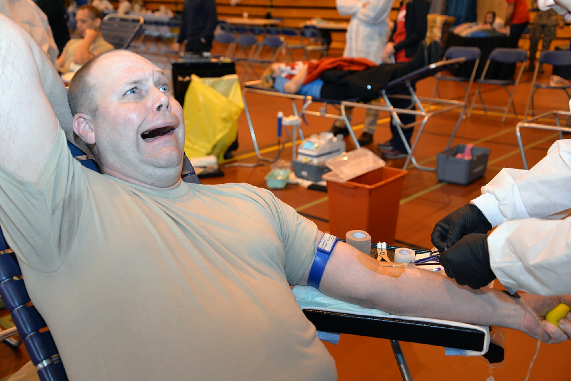 U.S. Air Force Master Sgt. Jason Hasty, 100th Air Refueling Wing Inspector General unit inspections and programs superintendent, jokes around as U.S. Air Force Staff Sgt. Sean Hudson, Armed Services Blood Program-Europe, Landstuhl Regional Medical Center medical lab technician, prepares Hasty’s arm to donate blood Feb. 7, 2017, at the blood drive on RAF Mildenhall, England. Team Mildenhall members attended throughout the day and donated more than 70 pints of blood. (U.S. Air Force photo by Karen Abeyasekere) 