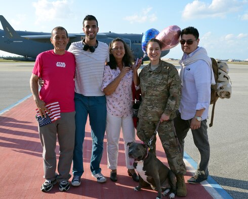 Staff Sgt. Paula Herrera poses in front of the C-17 Globemaster aircraft that transported her to Patrick Air Force Base, Fla., after a four-month deployment Feb. 8, 2017. Approximately 50 wing reservists who were deployed to Afghanistan were welcomed home by friends, family members and fellow Airmen on the Patrick AFB flight line. (U.S. Air Force photo by 1st Lt. Anna-Marie Wyant)