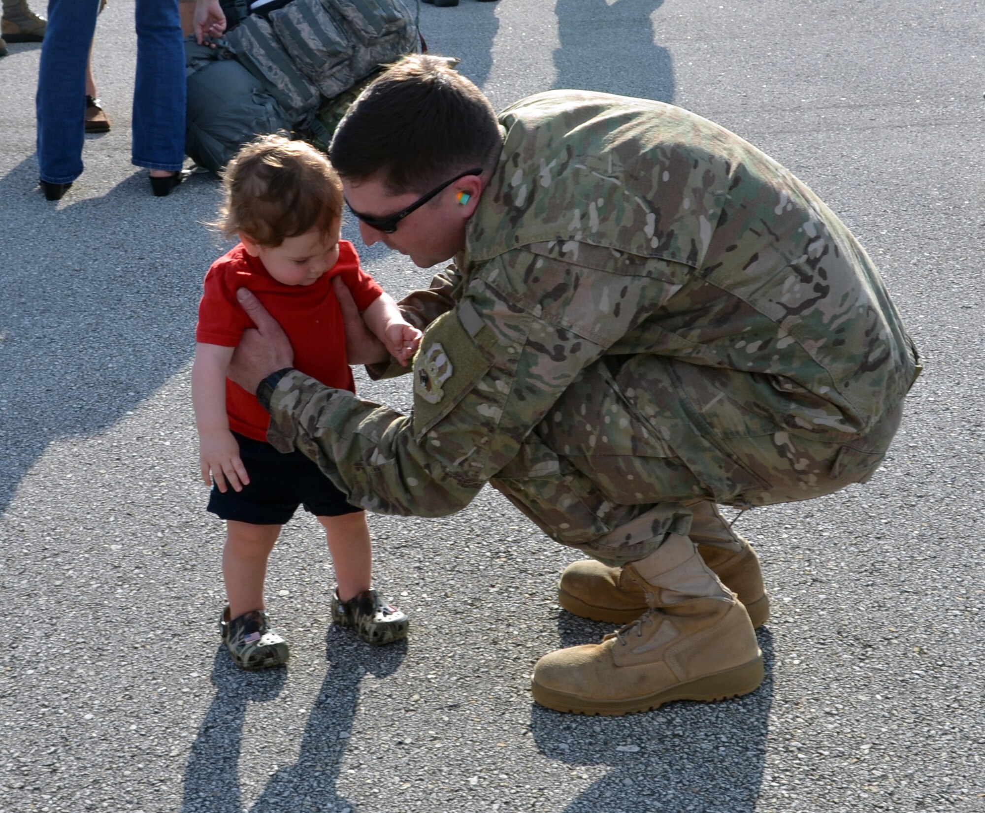 Staff Sgt. Gordon Grooms, a reservist from the 920th Aircraft Maintenance Squadron, greets his son at Patrick Air Force Base, Fla., upon return from a four-month deployment Feb. 8, 2017. Approximately 50 wing reservists were welcomed home by friends, family members and fellow Airmen on the Patrick AFB flight line. (U.S. Air Force photo by 1st Lt. Anna-Marie Wyant)
