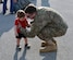 Staff Sgt. Gordon Grooms, a reservist from the 920th Aircraft Maintenance Squadron, greets his son at Patrick Air Force Base, Fla., upon return from a four-month deployment Feb. 8, 2017. Approximately 50 wing reservists were welcomed home by friends, family members and fellow Airmen on the Patrick AFB flight line. (U.S. Air Force photo by 1st Lt. Anna-Marie Wyant)