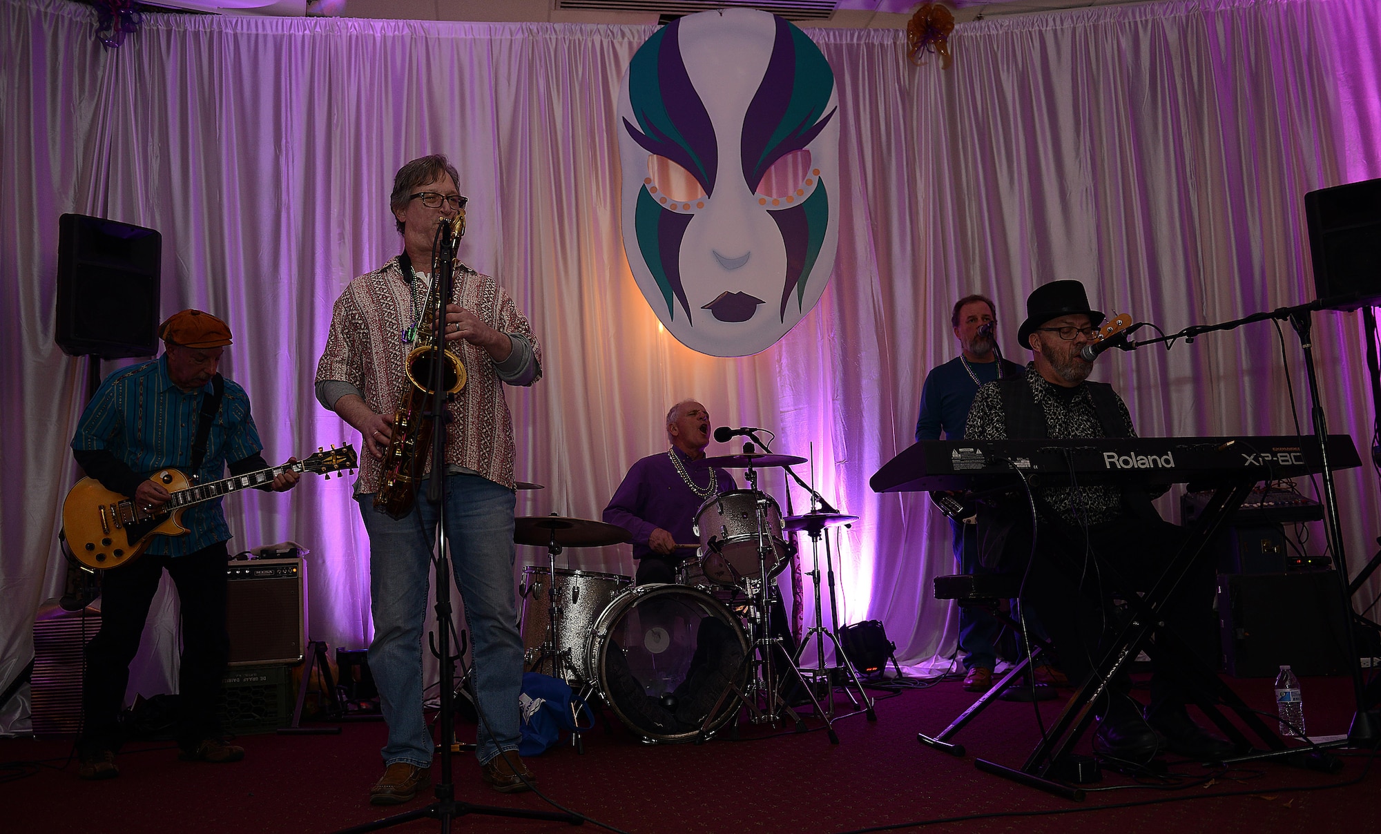 The Zydeco-A-Go-Go band performs during the Mardi Gras event hosted at the Fort Eustis Club at Joint Base Langley-Eustis, Va., Feb, 3, 2017. The celebratory event included live music, dancing, traditional Cajun food, casino games and a gift shop. (U.S. Air Force photo by Staff Sgt. Teresa J. Cleveland)