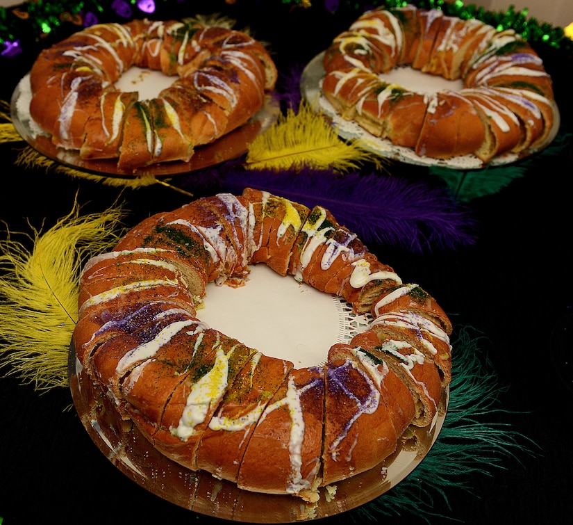 King’s cake and traditional Cajun food is served during the Mardi Gras event hosted at the Fort Eustis Club at Joint Base Langley-Eustis, Va., Feb, 3, 2017. King’s cake, or three king’s cake, is traditionally served at Mardi Gras celebrations and includes a small toy baby in it. The individual who gets the slice of cake with the baby in it is said have good luck all year. (U.S. Air Force photo by Staff Sgt. Teresa J. Cleveland)
