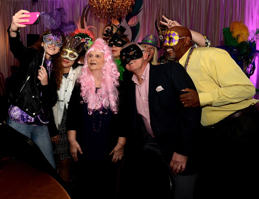 Guests take a photo in traditional Mardi Gras masks during the Mardi Gras event hosted at the Fort Eustis Club at Joint Base Langley-Eustis, Va., Feb, 3, 2017. While Mardi Gras is largely hosted in New Orleans, La., many installations host morale celebrations to recognize the event. (U.S. Air Force photo by Staff Sgt. Teresa J. Cleveland)