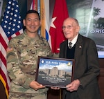Maj. Gen. K.K. Chinn, commanding general, U.S. Army South (left), presents retired Maj. Gen. Floyd Baker, former Brooke Army Medical Center commander, with a token of appreciation Feb. 3 for being the guest speaker of 80th anniversary of building 1000 at Joint Base San Antonio-Fort Sam Houston, known as "Old BAMC."
