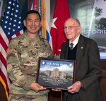 Maj. Gen. K.K. Chinn, commanding general, U.S. Army South (left), presents retired Maj. Gen. Floyd Baker, former Brooke Army Medical Center commander, with a token of appreciation Feb. 3 for being the guest speaker of 80th anniversary of building 1000 at Joint Base San Antonio-Fort Sam Houston, known as "Old BAMC."