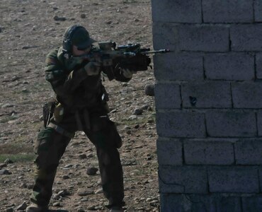 A Norwegian soldier acts as an enemy during urban operations training with Peshmerga soldiers near Erbil, Iraq January 17. Dutch and Norwegian soldiers, part of the Kurdistan Training Coordination Center, oversaw the day's training which included individual movement techniques, counter IED and entry control point procedures. The KTCC is a multi-national coalition dedicated to the training, advising and assistance of Kurdish forces to defeat ISIL in Iraq.