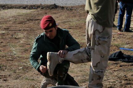 A Peshmerga soldier conducts a search on a Dutch soldier during entry control point training near Erbil, Iraq. The Dutch, part of the Kurdistan Training Coordination Center, oversaw the day's training which included urban operations. The KTCC is a multi-national coalition dedicated to the training, advising and assistance of Kurdish forces to defeat ISIL in Iraq.