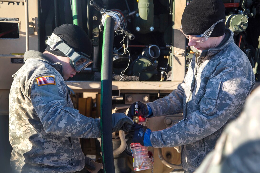Alaska Army Guardsmen perform a fuel quality test before conducting aircraft refueling training at Joint Base Elmendorf-Richardson, Alaska, Feb. 1, 2017. Air Force photo by Alejandro Pena