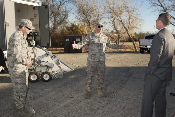 Jeff Gorell, deputy mayor for Homeland Security and Public Safety, Los Angeles (right), meets with Explosive Ordnance Disposal Airmen from the 812th Civil Engineering Squadron Jan. 31. (U.S. Air Force photo by Ethan Wagner)