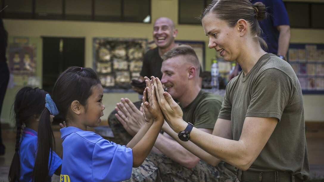 Marine Corps 1st Lt. Kellie Darmody plays with a student during Cobra Gold 2017 at Juksamed School in Thailand, Feb. 8, 2017. The exercise focused on supporting the humanitarian and medical needs of communities in the region. Marine Corps photo by Cpl. Wesley Timm