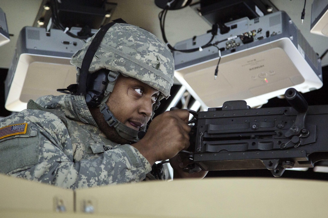 Army Pfc. Derek Davis engages simulated enemy targets while conducting reconfigurable vehicle tactical training at Joint Base Elmendorf-Richardson, Alaska, Feb. 1, 2017. Davis is assigned to the 574th Composite Supply Company, 17th Combat Sustainment Support Battalion, Alaska. Air Force photo by Alejandro Pena