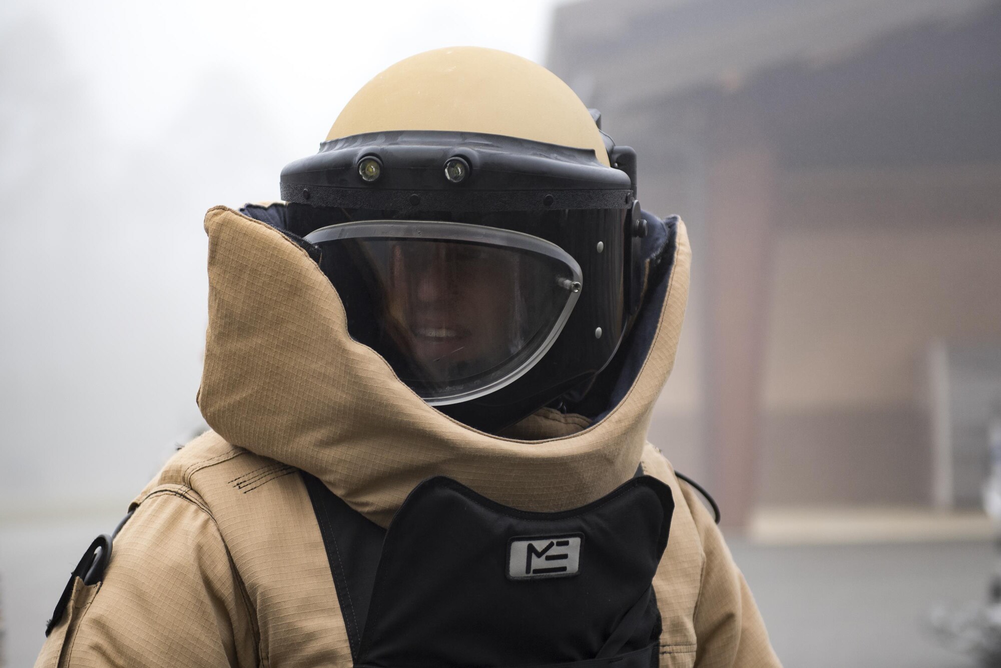 Capt. David Melear, 23d Wing assistant staff judge advocate, dons an Explosive Ordnance Disposal suit during an Emerge Moody course, Feb. 2, 2017, at Moody Air Force Base, Ga. The bomb suit provides EOD technicians protection against fragmentation, impact and heat while handling explosives. (U.S. Air Force photo by Airman 1st Class Daniel Snider)