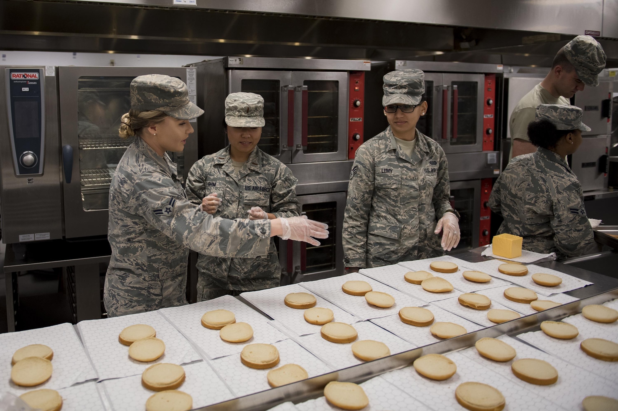 Airman 1st Class Ardella Ring, 23d Force Support Squadron food service apprentice, shows 2nd Lt. Esther Shim and Senior Airman Alyssa Lemy, both students of Emerge Moody, the food preparation process at the Georgia Pines Dining Facility, Feb. 2, 2017, at Moody Air Force Base, Ga. This was the fifth time the members of Emerge Moody met to tour Moody’s facilities. (U.S. Air Force photo by Airman 1st Class Daniel Snider)