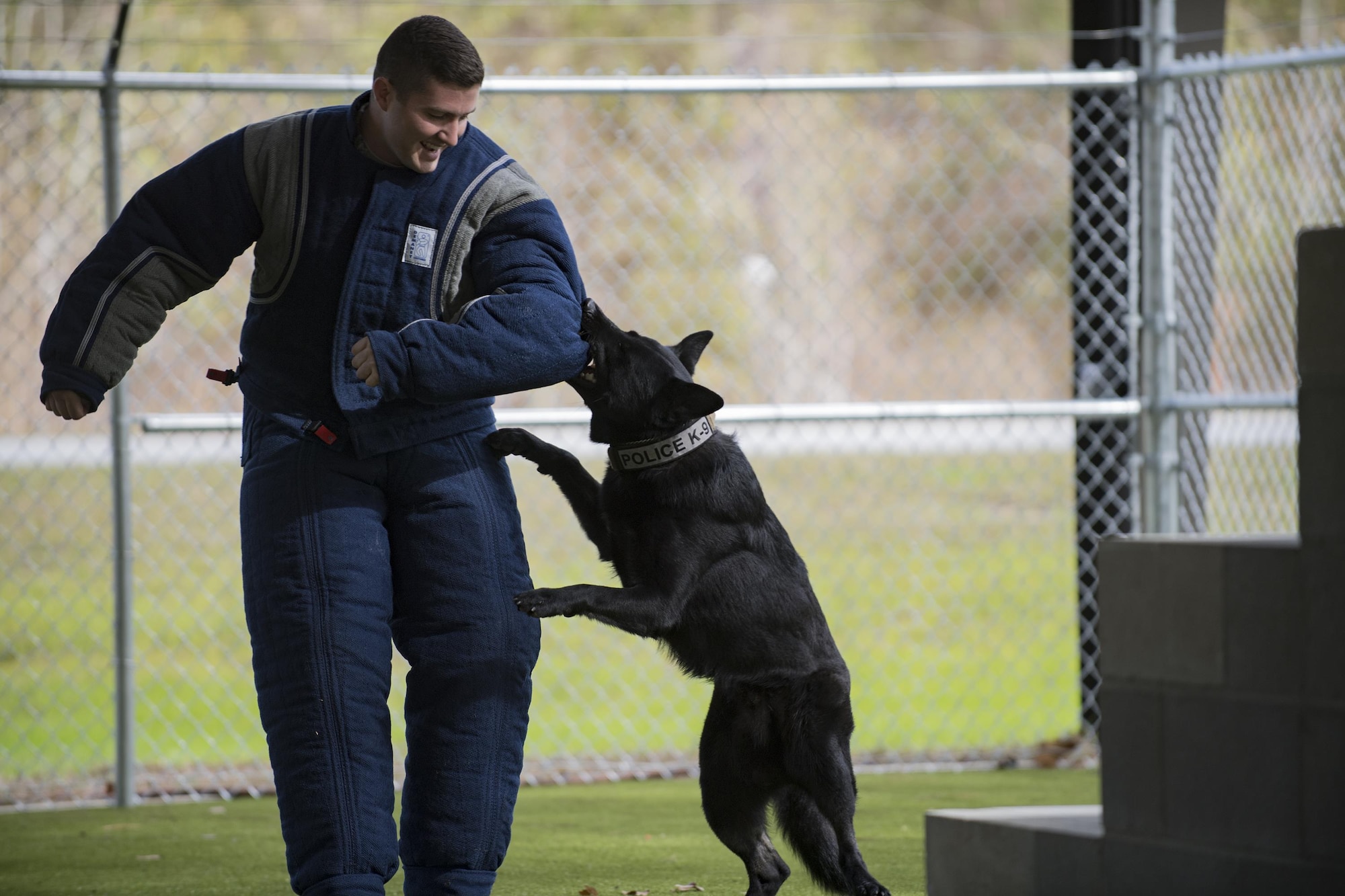 Buster, 23d Security Forces Squadron military working dog, latches onto the arm of 2nd Lt. Ryan Noblin, 75th Aircraft Maintenance Unit officer in charge, during an Emerge Moody course, Feb. 2, 2017, at Moody Air Force Base, Ga. Buster was trained as part of the Department of Defense MWD program, which is the world's largest training center for military dogs and handlers located at Joint Base San Antonio-Lackland, Texas. (U.S. Air Force photo by Airman 1st Class Daniel Snider)