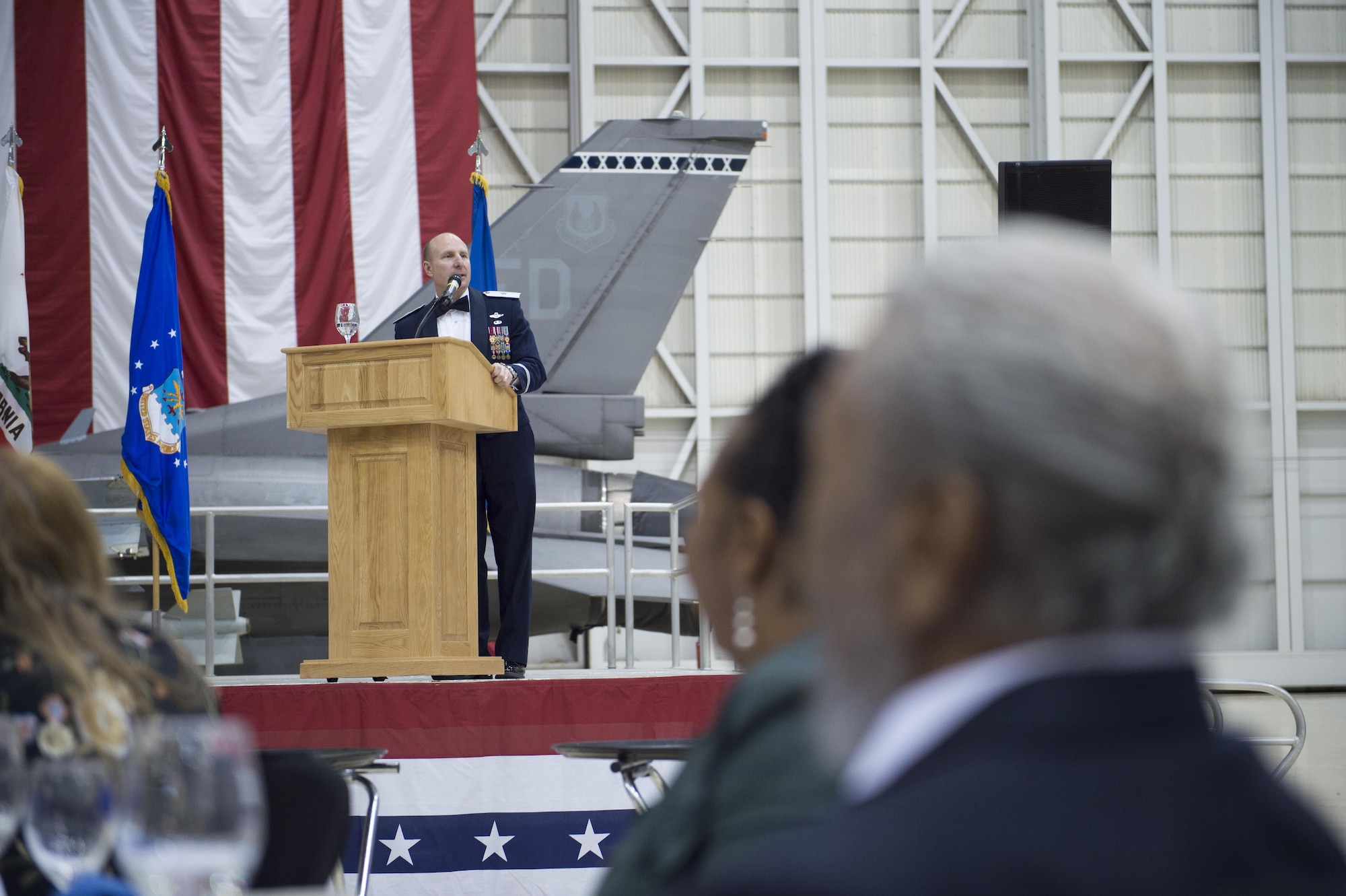 Brig. Gen. Carl Schaefer takes the stage at the 412th Test Wing Annual Awards Banquet held in Hangar 1600 Feb. 3. (U.S. Air Force photo by Joseph Gocong)