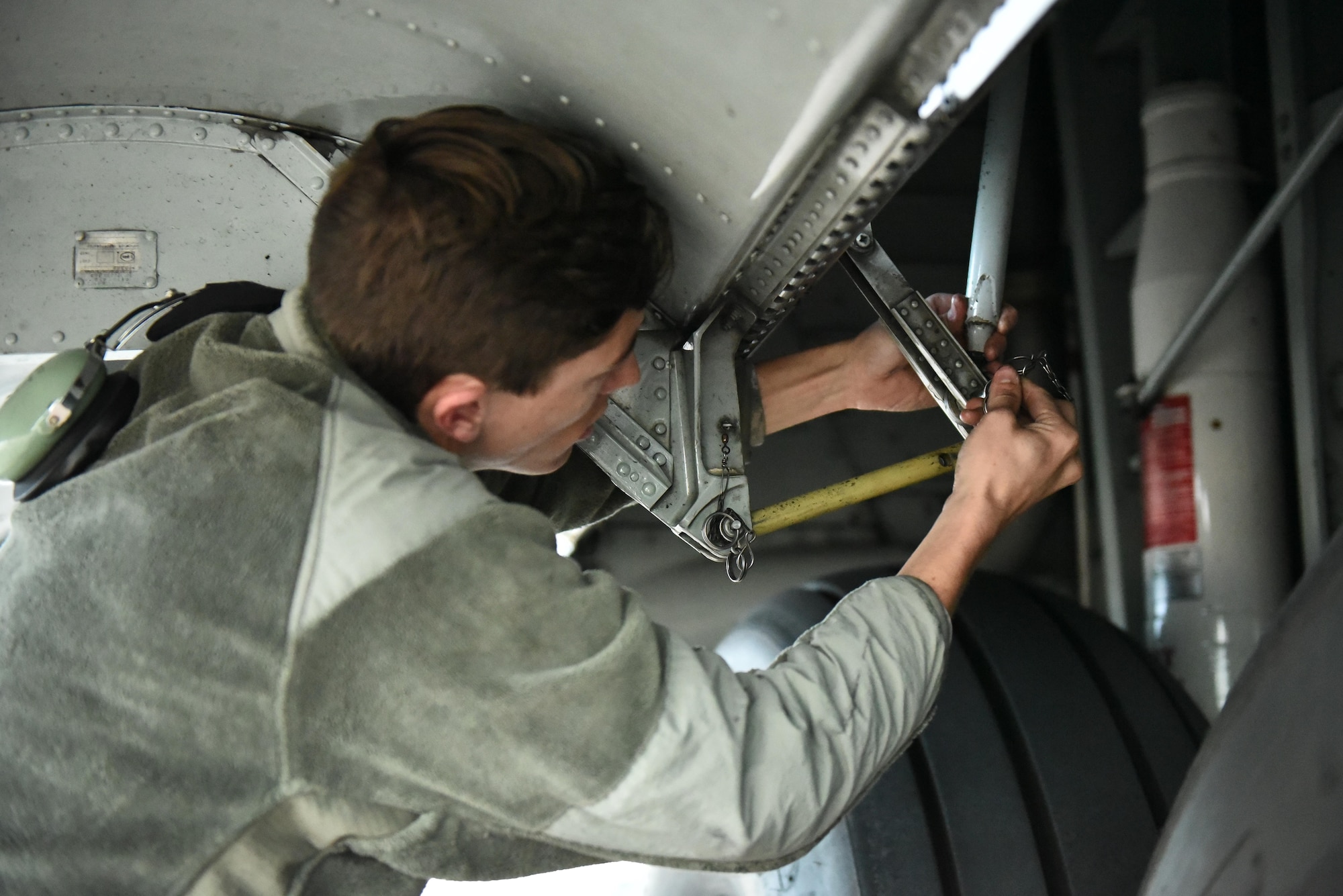 Senior Airman Drew Roberts works on landing gear of a 165th Airlift Wing C-130H3 Hercules during Operation Mangusta in Pisa, Italy. (U.S. Air National Guard photo by Senior Airman Brandon Patterson)
