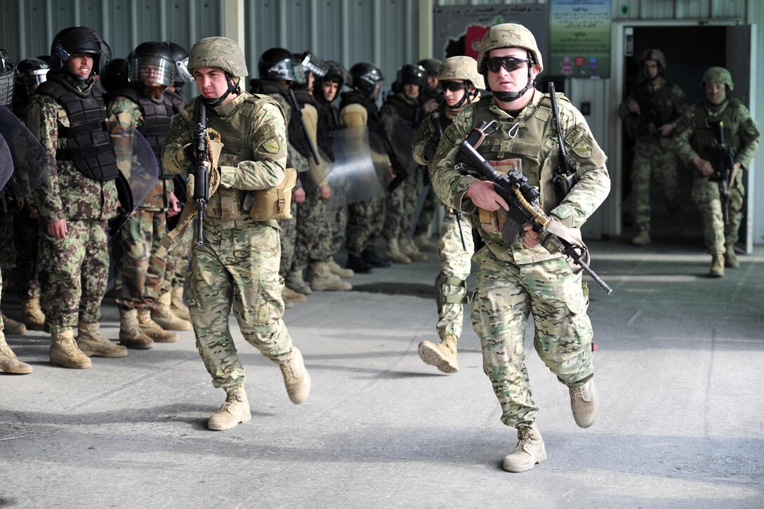 Soldiers with the 32nd Georgian Light Infantry Battalion respond to an exercise call for support at the National Detention Facility in Parwan, Afghanistan, Jan. 17, 2017. Photo by Bob Harrison, U.S. Forces Afghanistan Public Affairs
