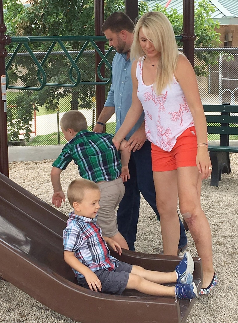 Jeanette and Daryl Naschke play with their boys, 5-year-old Austin and 3-year-old Nolan, in the park. Jeanette Naschke was severely injured in a car accident in May 2015 and received care at Brooke Army Medical Center and the Center for the Intrepid at Joint Base San Antonio-Fort Sam Houston. She is now able to enjoy her life with her family.