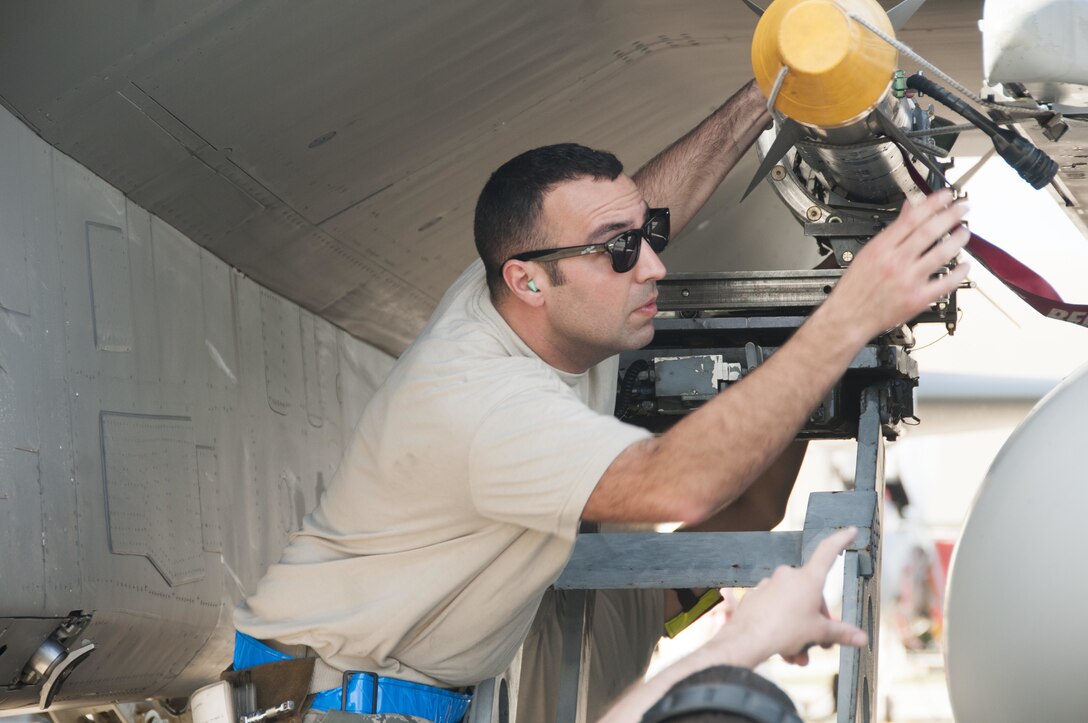 Tech. Sgt. Lucas Hagopian, Weapons Load Crew Chief from the 104th Fighter Wing, arms an F-15 Eagle with an Aim 9X missile during the unit's evaluation at the U.S. Air Force's Weapons Systems Evaluation Program (WSEP). As a part of the WSEP exercise, the aircraft are loaded and shoot live missiles. The purpose of WSEP to gauge operational effectiveness, to verify weapons system performance, determine reliability, and evaluate capability. (U.S. Air National Guard Photo by Senior Master Sgt. Julie Avey)