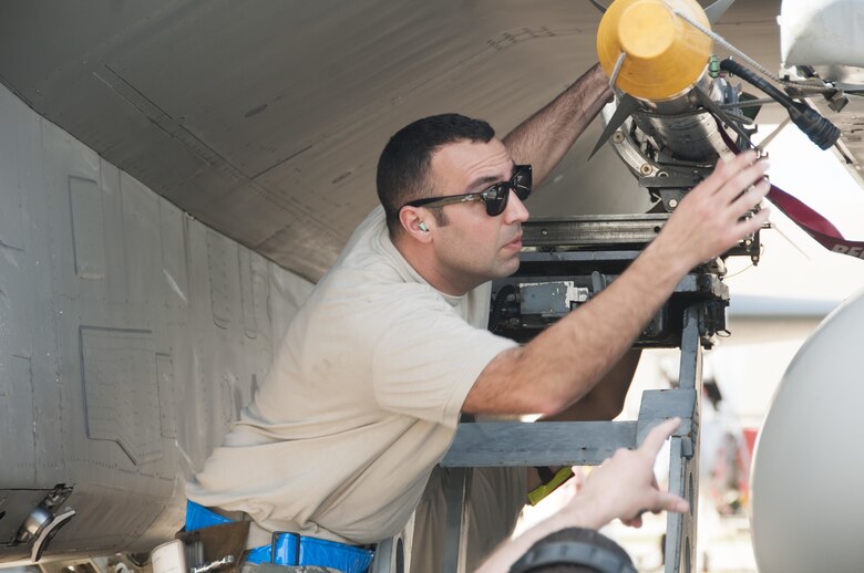 Tech. Sgt. Lucas Hagopian, Weapons Load Crew Chief from the 104th Fighter Wing, arms an F-15 Eagle with an Aim 9X missile during the unit's evaluation at the U.S. Air Force's Weapons Systems Evaluation Program (WSEP). As a part of the WSEP exercise, the aircraft are loaded and shoot live missiles. The purpose of WSEP to gauge operational effectiveness, to verify weapons system performance, determine reliability, and evaluate capability. (U.S. Air National Guard Photo by Senior Master Sgt. Julie Avey)