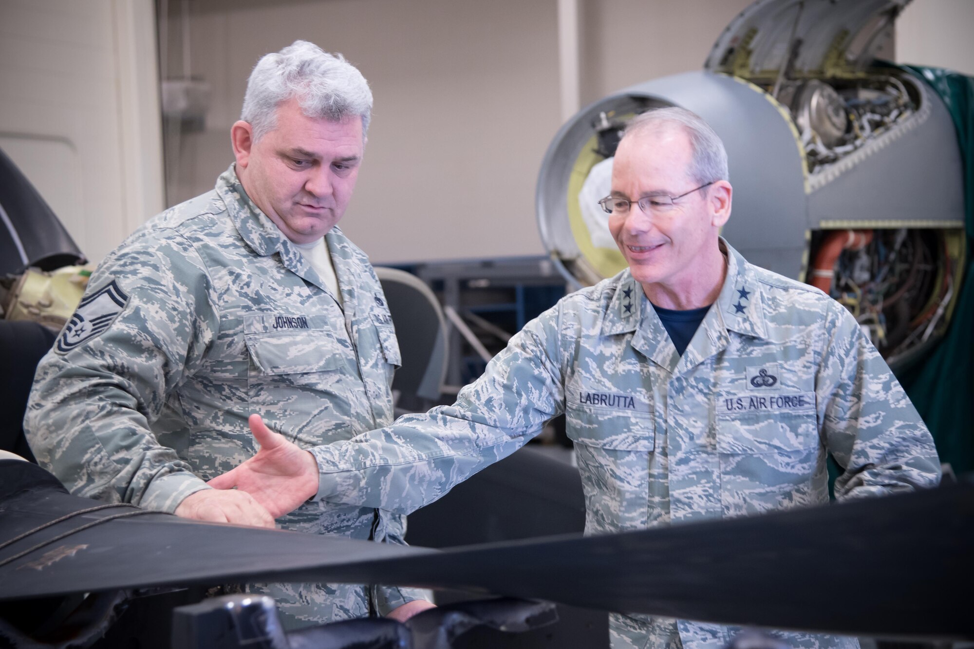 Senior Master Sgt. Eric Johnson explains the mission of the 403rd Maintenance Squadron's propulsion shop to Maj. Gen. Robert LaBrutta, 2nd Air Force commander, during his 403rd Wing immersion tour Feb. 3 at Keesler Air Force Base, Mississippi. (U.S. Air Force photo/Staff Sgt. Heather Heiney)