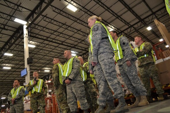 Members of the Pa. Air and Army National Guard follow a problem-identification flow during a tour of a popular online merchandise vendor’s fulfillment center Jan. 31, in Carlisle, Pa. The tour was part of the Lean Six Sigma program, which was adopted by the National Guard to increase productivity and readiness for defense processes. (U.S. Air National Guard photo by Tech. Sgt. Andria Allmond)