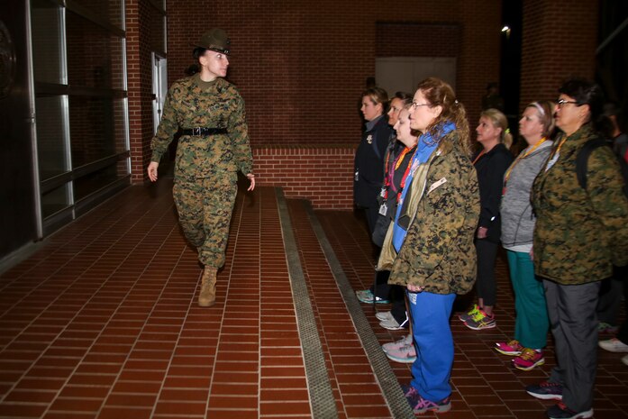 Staff Sergeant Jessica C. Navarro, a senior drill instructor, 4th Recruit Training Battalion, Recruit Training Regiment, instructs educators during Recruiting Stations (RS) Montgomery and Nashville Educators Workshop aboard Marine Corps Recruit Depot Parris Island, South Carolina, Feb. 8, 2017. The educators come from across Alabama, Mississippi, and Tennessee to experience the workshop. The Educators Workshop provides an opportunity to educators to have an inside look at Marine Corps training to better inform students in their local area. (U.S. Marine Corps photo by Lance Cpl. Jack A. E. Rigsby/Released)