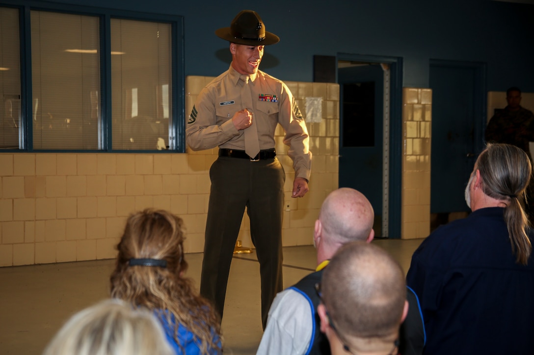 Staff Sergeant Bradley W. Hoffman, a senior drill instructor, 3rd Recruit Training Battalion, Recruit Training Regiment, speaks to educators during Recruiting Stations (RS) Montgomery and Nashville Educators Workshop aboard Marine Corps Recruit Depot Parris Island, South Carolina, Feb. 8, 2017. The educators come from across Alabama, Mississippi, and Tennessee to experience the workshop. The Educators Workshop provides an opportunity to educators to have an inside look at Marine Corps training to better inform students in their local area. (U.S. Marine Corps photo by Lance Cpl. Jack A. E. Rigsby/Released)