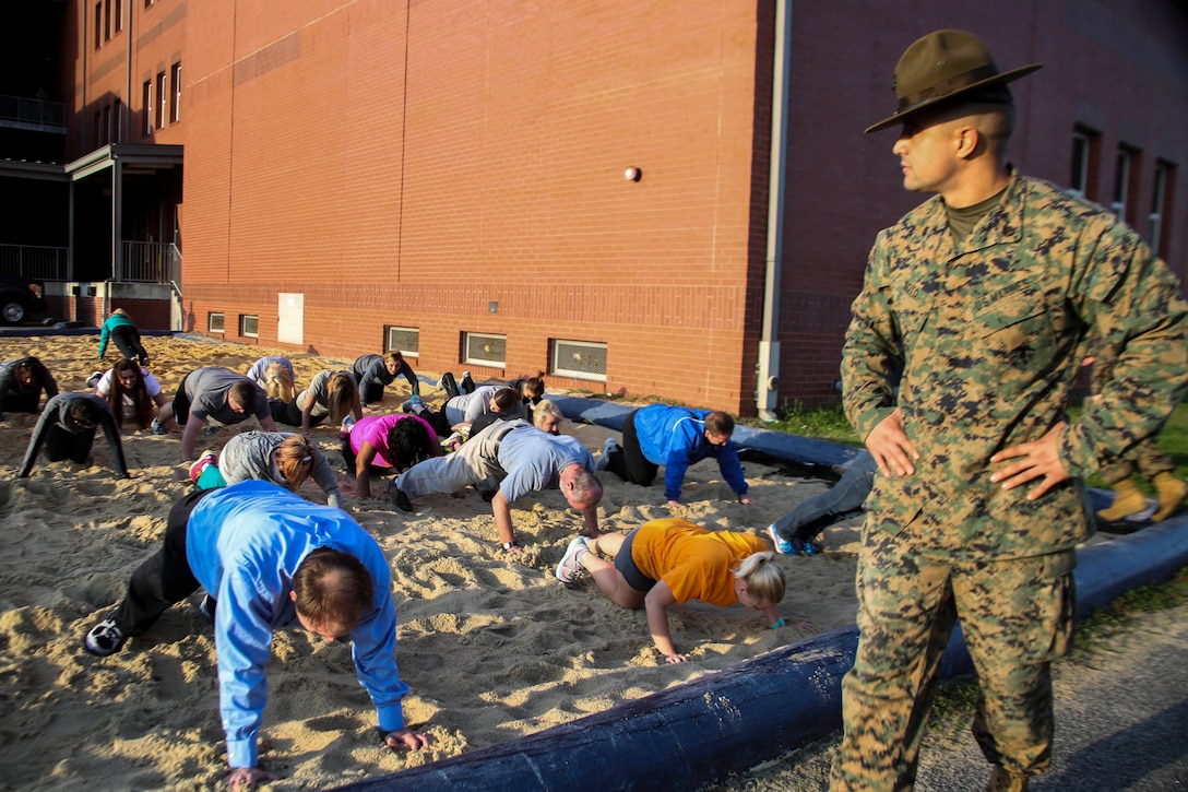 Staff Sergeant Gabriel Soto, a senior drill instructor, 3rd Recruit Training Battalion, Recruit Training Regiment, gives incentive training to educators during Recruiting Stations (RS) Montgomery and Nashville Educators Workshop aboard Marine Corps Recruit Depot Parris Island, South Carolina, Feb. 8, 2017. The educators come from across Alabama, Mississippi, and Tennessee to experience the workshop. The Educators Workshop provides an opportunity to educators to have an inside look at Marine Corps training to better inform students in their local area. (U.S. Marine Corps photo by Lance Cpl. Jack A. E. Rigsby/Released)