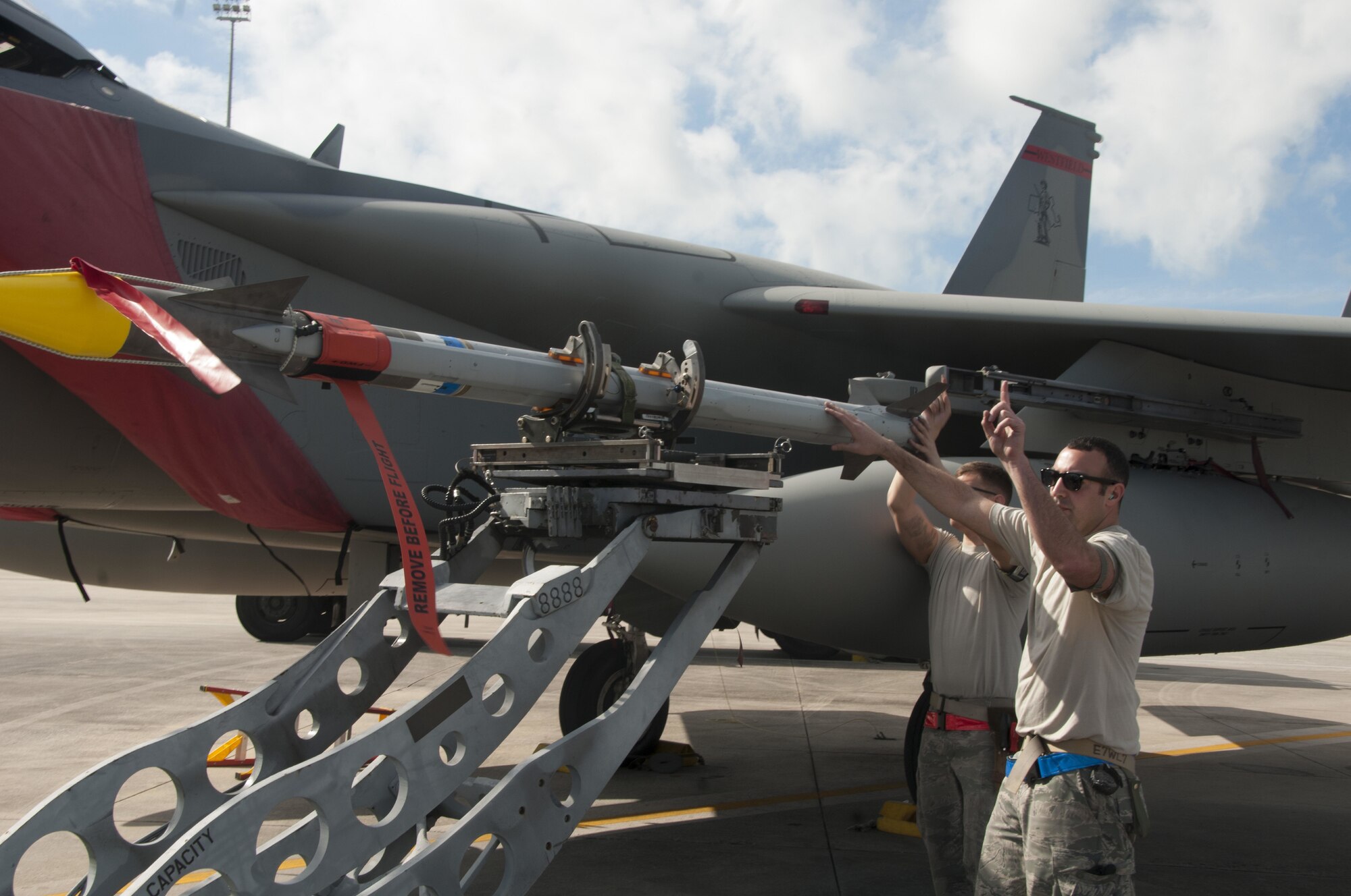 Tech Sgt. Lucas Hagopian of the 104th Fighter Wing, directs his load crew while arming the F-15 Eagle with an Aim 9X at the U.S. Air Force’s Weapons System Evaluation Program (WSEP) at Tyndall, Air Force Base, Florida. As a part of the WSEP exercise, the aircraft are loaded and shoot live missiles. The purpose of WSEP to gauge operational effectiveness, to verify weapons system performance, determine reliability, and evaluate capability. (U.S. Air National Guard Photo by Senior Master Sgt. Julie Avey)