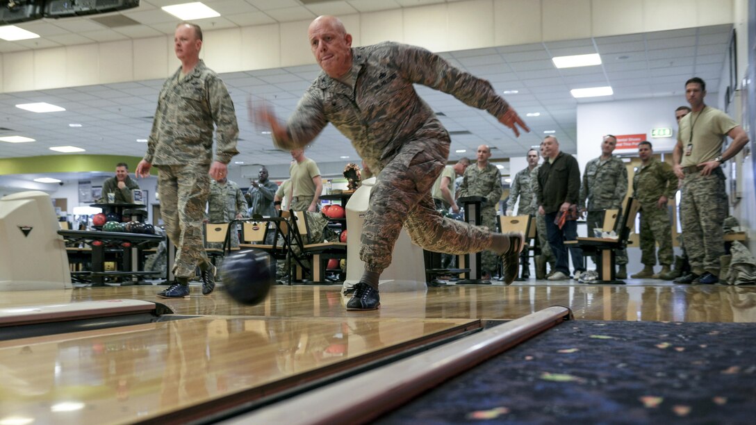 Air Force Col. Kelly Scott bowls during a "Chiefs vs. Eagles" game on Royal Air Force Mildenhall, England, Feb. 7, 2017. Scott is the commander for the 100th Maintenance Group. Team Mildenhall leaders take part in quarterly recreational events to build camaraderie. Air Force photo by Staff Sgt. Micaiah Anthony